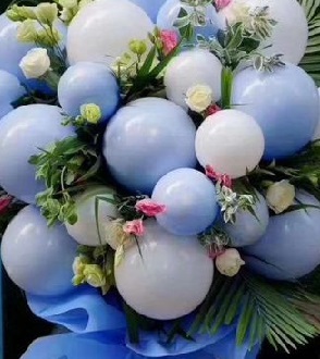 15 Blue balloons with 15 White and pink roses stuffed in between
