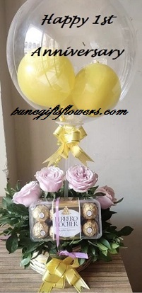 Transparent balloon with happy 1st anniversary 16 ferrero chocolates leaves flowers