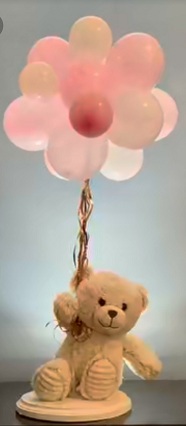 6 inch teddy with 12 pink balloons on stick and lights and flowers