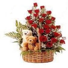 two teddy bears with 24 roses in same basket