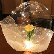 1 Balloons with 1 yellow rose inside transparent balloon with white Wrapping