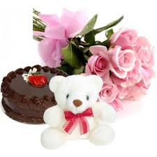 A bouquet of 12 roses 1/2 kg cake and teddy