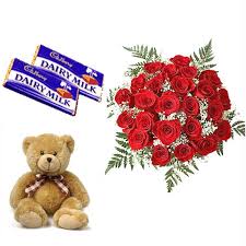 A bouquet of 15 red roses 2 chocolates and a teddy bear