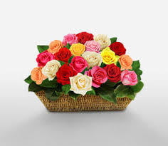 Two dozen assorted spring roses arranged in a basket