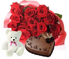 A bouquet of 40 red roses 1 kg chocolate truffle heart cake and a teddy bear