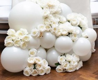 50 White roses stuffed in between 15 white balloon bouquet