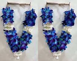 A pair of orchid garlands