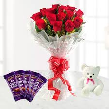 A bouquet of 10 red roses 4 silk chocolates and teddy bear