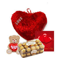 A red cushion heart, card, 16 ferrero rocher chocolates and teddy bear