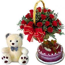 A basket of 12 roses 1/2 kg cake and teddy