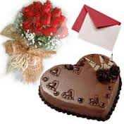 A bouquet of 20 red roses 1 kg chocolate truffle heart cake and a greeting card