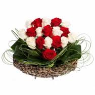 An Arrangement of 15 red and white roses