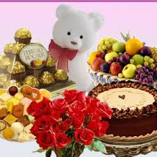 1/2 kg cake with 1/2 kg mithai and 16 ferrero rocher chocolates fruits and teddy bear