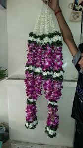 A pair of orchid garlands