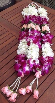 A pair of orchid and white tuberoses garlands