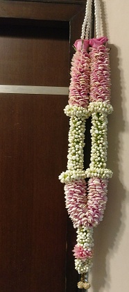 2 garlands with light pink flowers and beads