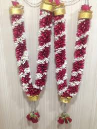 Wedding ceremony ritual traditional jaimala with fresh red roses for bride and groom