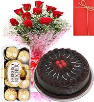 8 red roses bunch 16 ferrero rocher chocolates 1/2 kg chocolate cake and card