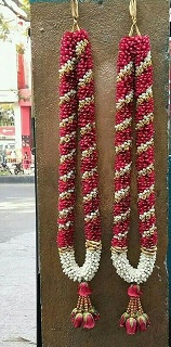 2 garlands with red and white flowers and beads