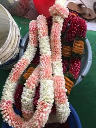 2 garlands with light pink flowers and beads